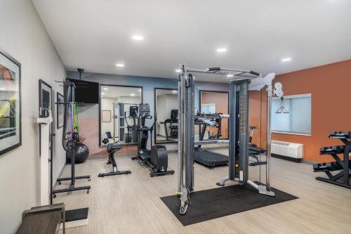 a gym with treadmills and machines in a room at Candlewood Suites Gonzales - Baton Rouge Area by IHG in Gonzales