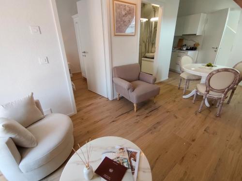 a living room with a couch and a table at Zogbi Hospitality Aubonne 3 in Aubonne