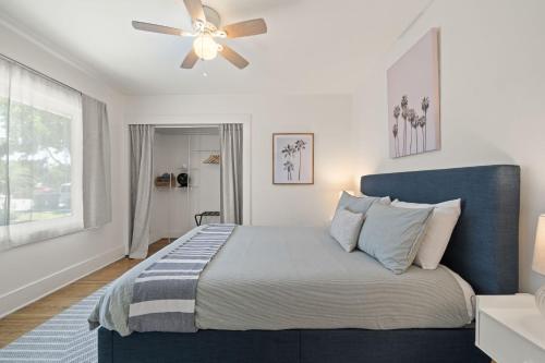 a bedroom with a bed with a ceiling fan at Walk to Beach - Beach Gear - Easy Parking in Long Beach