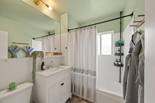 a white bathroom with a sink and a shower at Walk to Beach - Beach Gear - Easy Parking in Long Beach