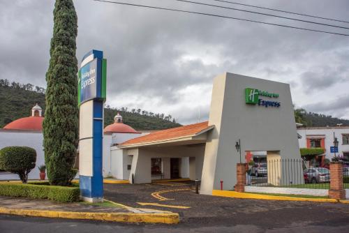 a gas station with a sign in front of it at Holiday Inn Express Morelia by IHG in Morelia