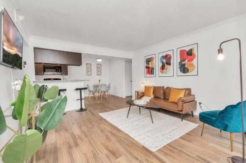 a living room with a couch and a table at Spacious-2BR2BA- King Ensuite- PVT Patio in Houston