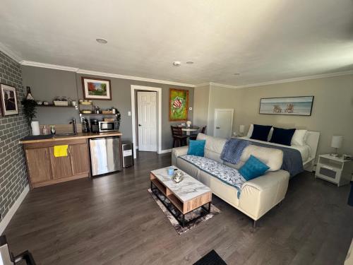 a living room with a couch and a table at Emmas place in Halifax