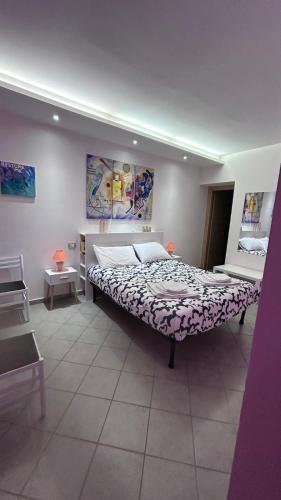 a bedroom with a large bed in a room at La Casa del Torrente in Rieti