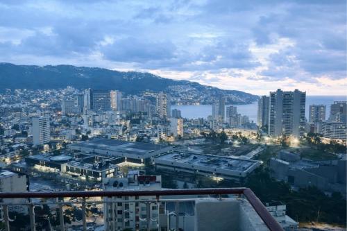 a view of a city from a building at Bella Brisas Stays in Acapulco