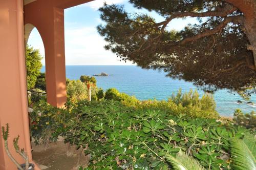 a view of the ocean from a house at Pool Apartments with panoramic Pelekas Beach view in Pelekas