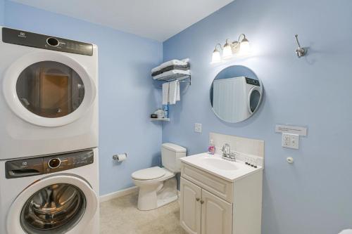 a bathroom with a washing machine and a sink at Unbeatable Downtown Location! Bar Harbor Apt in Bar Harbor