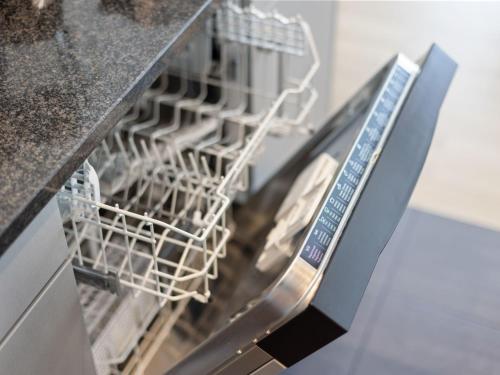 a dishwasher with a dish rack in it at Apartment Loft Seven by Interhome in Root