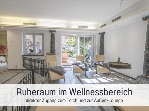 a living room with chairs and a table at Apartment BERNSTEIN by Interhome in Wertach
