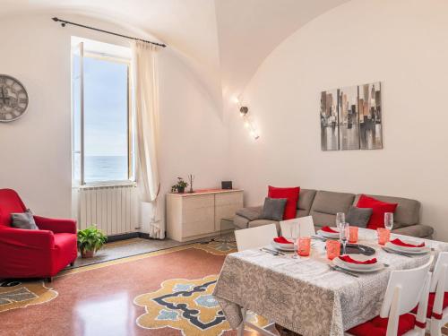 a living room with a table and a couch at Apartment Emanuela by Interhome in Alassio