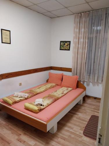 a bedroom with a large bed in a room at Скай Румс -2 in Sofia
