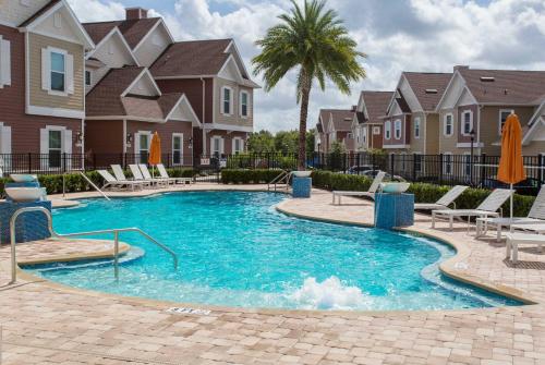 a swimming pool at a apartment complex at Gorgeous 4 Bedroom Family Friendly Close to Disney 7573 in Orlando
