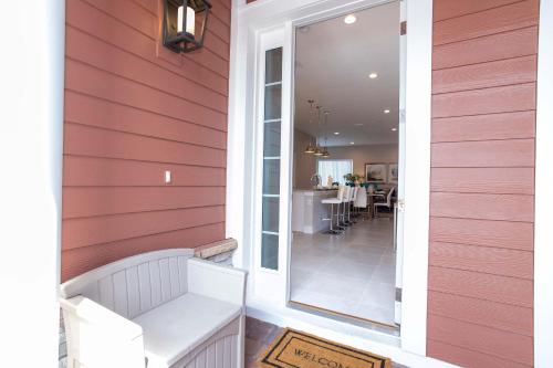 a home porch with red siding and a mirror at Gorgeous 4 Bedroom Family Friendly Close to Disney 7573 in Orlando