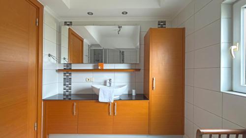 a bathroom with a sink and a mirror at Paradise Town Villa Premium in Belek