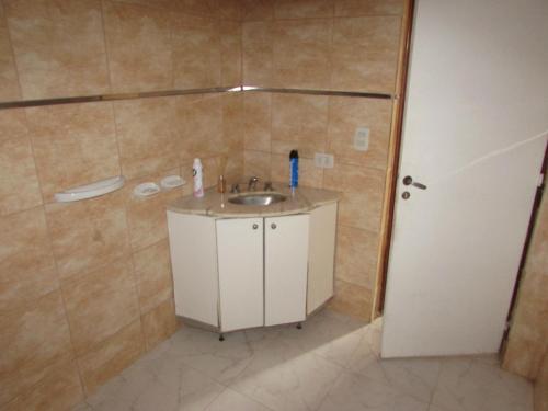 a bathroom with a sink and a shower at Chalet 1 Dormitorio Kallpa in Santiago del Estero