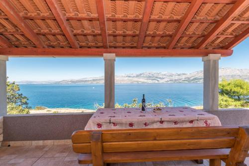 a table with a view of the water at House Svjetlana in Postira