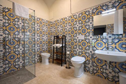 a bathroom with a toilet and a sink at VesConte Residenza D'epoca dal 1533 in Bolsena