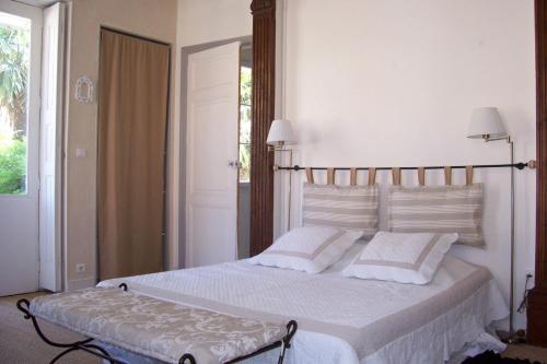 Postel nebo postele na pokoji v ubytování L'Orangerie