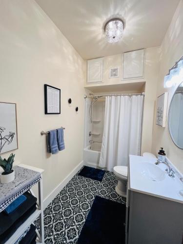 a bathroom with a sink and a toilet at Relaxing Townhouse Downtown Dubuque in Dubuque