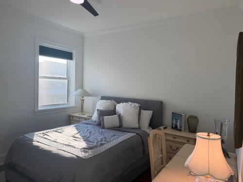 a bedroom with a bed and a window at The Lyons' Den in Chicago