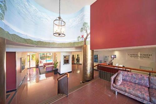 a large lobby with a couch and a chandelier at Lakefront Panorama – Classic in Canberra