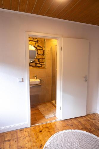 a bathroom with a shower and a sink at Haus Eifelglück am Stausee Obermaubach in Kreuzau