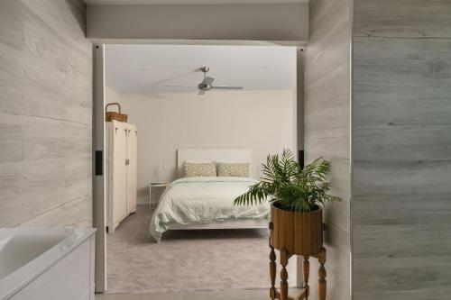a bedroom with a bed and a large mirror at An Unforgettable View in Dixons Creek