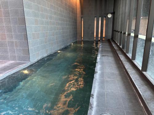 a swimming pool in a building with water in it at Unit in Belconnen sleep up to 4 - 2Brm, 2 Bath in Belconnen