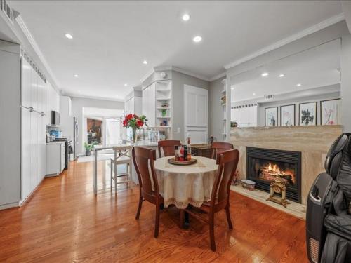 a dining room with a table and a fireplace at May House in Washington, D.C.