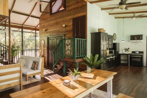 a living room with a table and a kitchen at Casa de Mono Bocas in Big Creek