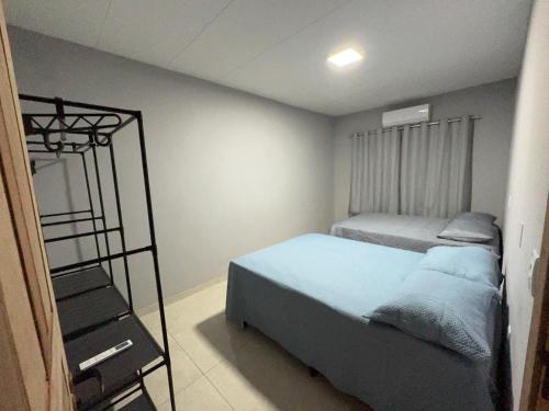 a bedroom with two beds and a bunk bed at Aconchego em Piranhas in Piranhas