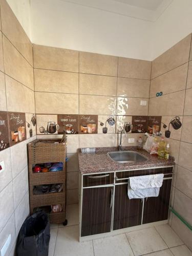 a small bathroom with a sink and a counter at Nabi Daniel Residence بيت البنات in Alexandria