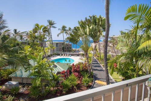 a view of the pool from the balcony of a resort at Alii Villas in Kailua-Kona