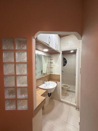 a bathroom with a sink and a toilet at Talna in Baguio