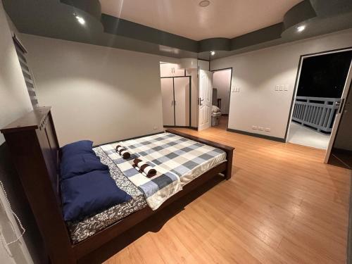 a bedroom with a bed with a dog on it at Talna in Baguio