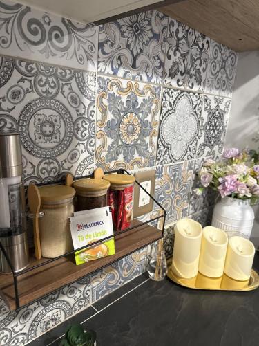 a kitchen with a shelf with pots and pans at Apartment in the heart of Mexico City's historic in Mexico City