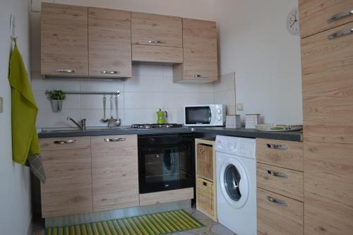 A kitchen or kitchenette at Charming Place Taormina