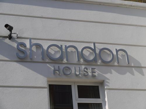 The logo or sign for the guesthouse 