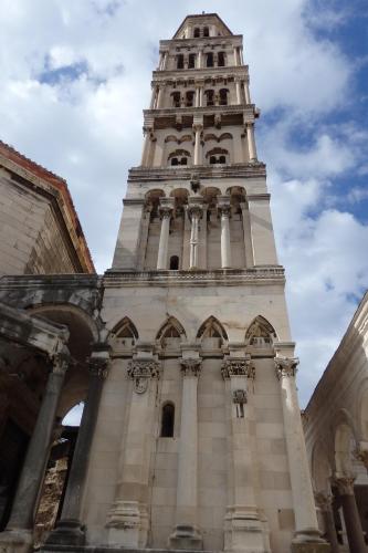 a tall building with a clock tower on top at Apartments & Bungalows Ivanović in Kaštela