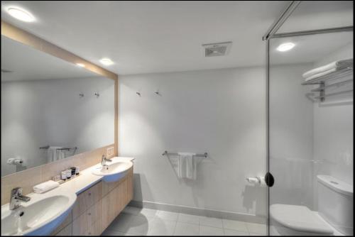 a bathroom with a sink and a shower at Pool View Retreat in Ballina