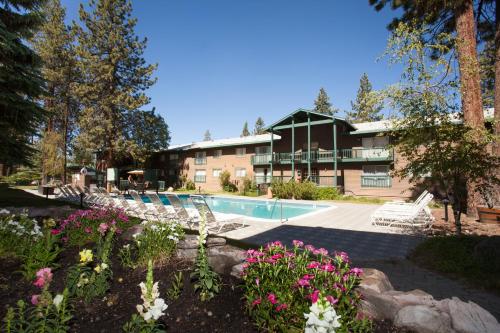 a resort with a swimming pool and some flowers at Forest Suites Resort at the Heavenly Village in South Lake Tahoe