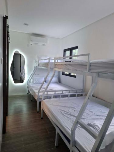 a group of bunk beds in a room at Casa Marangle Private Villa in Mexico