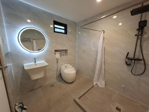 a bathroom with a sink and a mirror at Casa Marangle Private Villa in Mexico