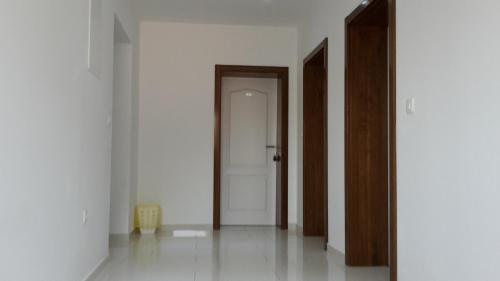 an empty room with an open door and white walls at Hotel ''Marinko Kozina'' - Medjugorje in Međugorje
