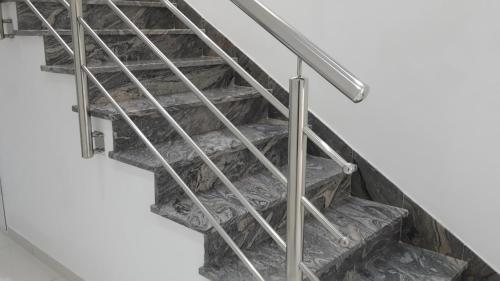 a set of stairs with metal railings at Hotel ''Marinko Kozina'' - Medjugorje in Međugorje
