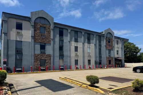 a large building with a car parked in a parking lot at Gallus Stadium Park Inn, an Ascend Collection Hotel in Columbia
