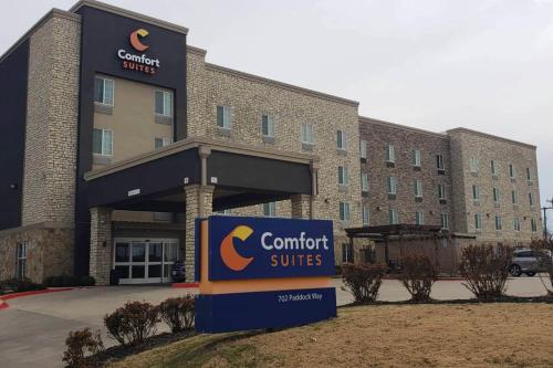 a building with a sign in front of it at Comfort Suites Grand Prairie - Arlington North in Grand Prairie
