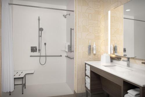 a bathroom with a sink and a shower at Home2 Suites By Hilton Concord Charlotte in Concord