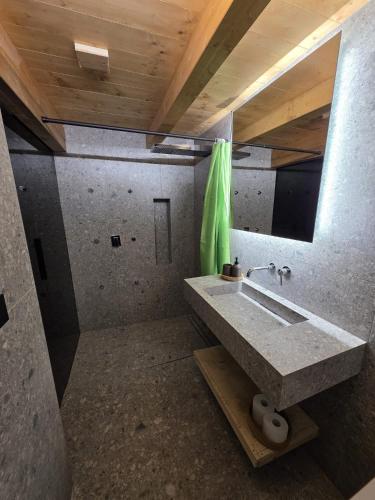 a bathroom with a sink and a mirror at Muranche Lofts N1 in Valtournenche