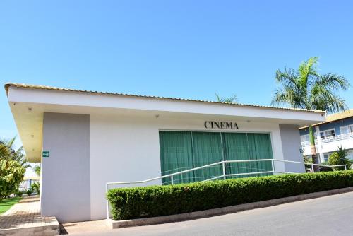 a white building with a sign on it at Lacqua diRoma 1 - Apartamentos JN in Caldas Novas